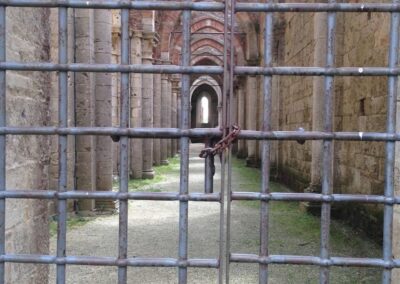 row of arches seen through locked gate