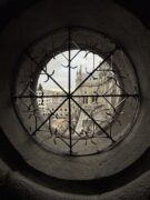 city as seen through a round window