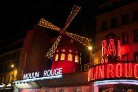 48 Hours in Paris: The Perfect 2-Day Itinerary for First-Timers 41 Brightly illuminated Moulin Rouge windmill in Paris at night.