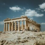 Mediterranean Cruise Part 3: Greece and Turkiye 15 Low angle shot of the Parthenon, Athens, with tourists against a clear blue sky.