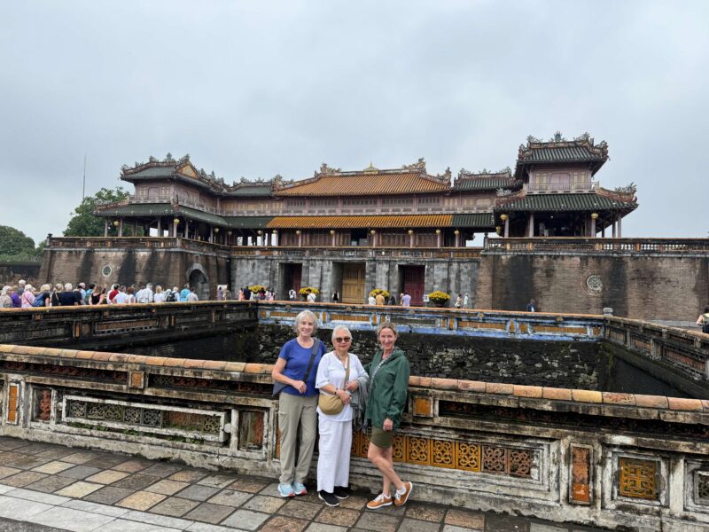 Hue Travel Guide: Imperial Vietnam, Tombs & Why It’s Worth a Stop 13 three women in front of imperial cit, hue vietnam